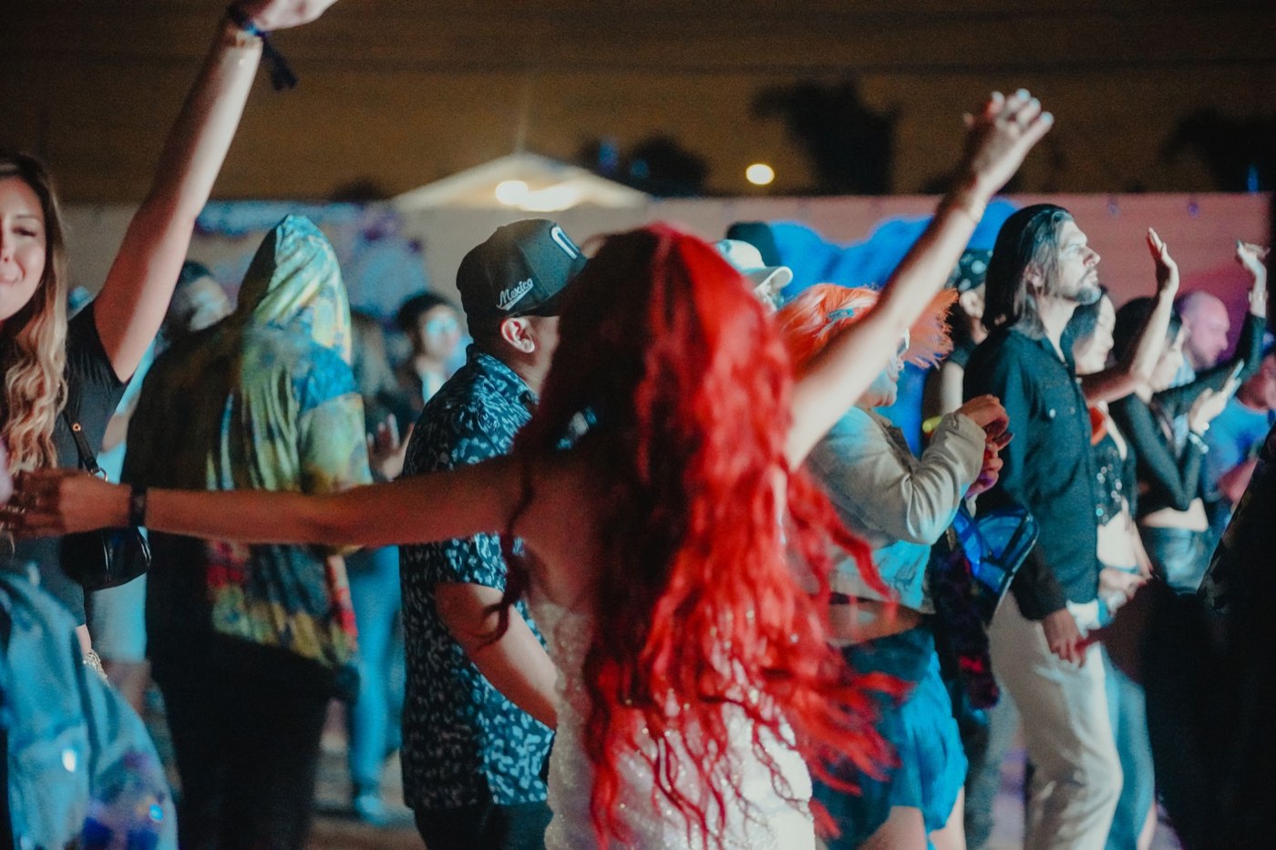 Crowd dancing under red light