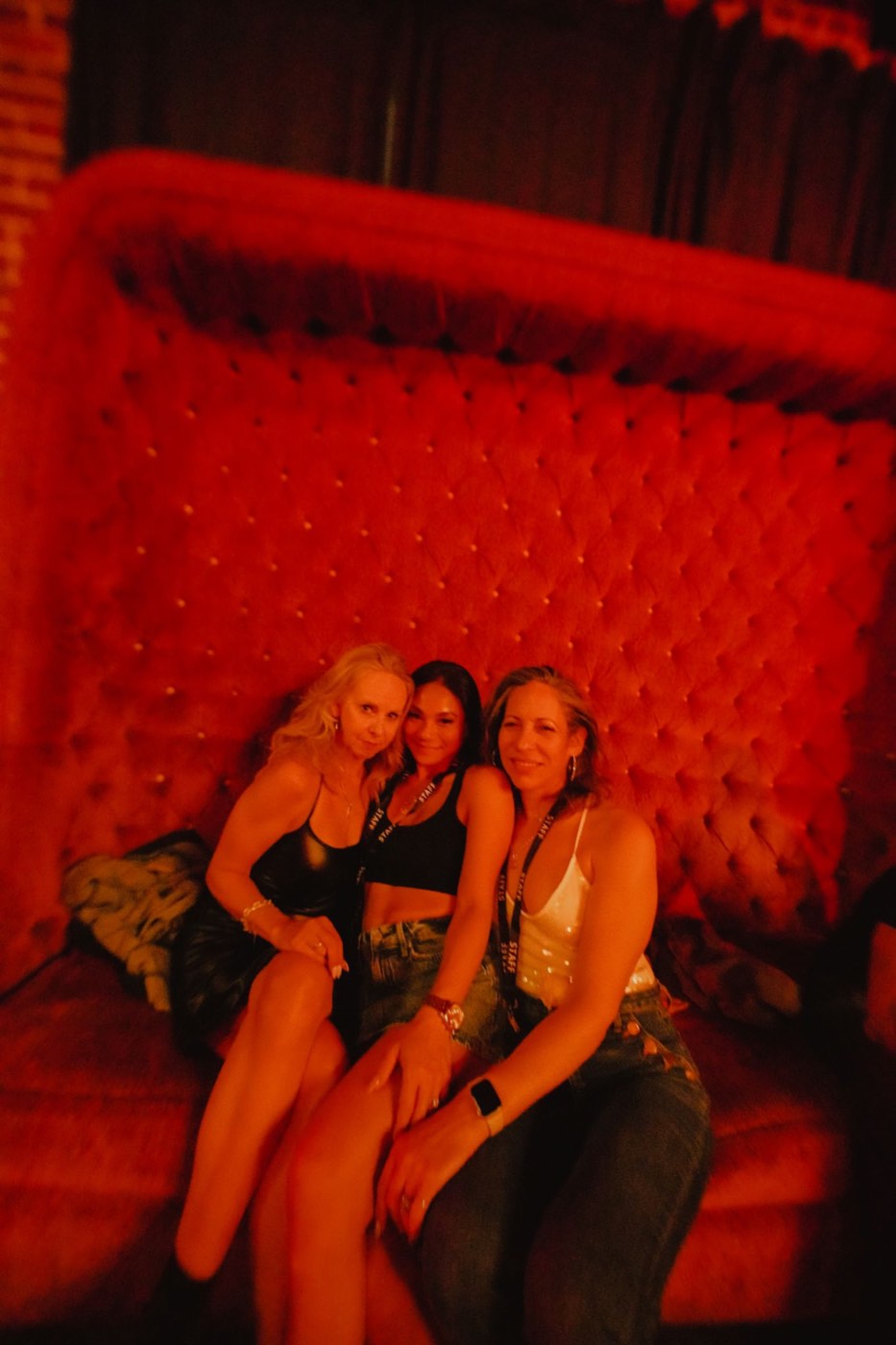 Performers posed together on the lit stage