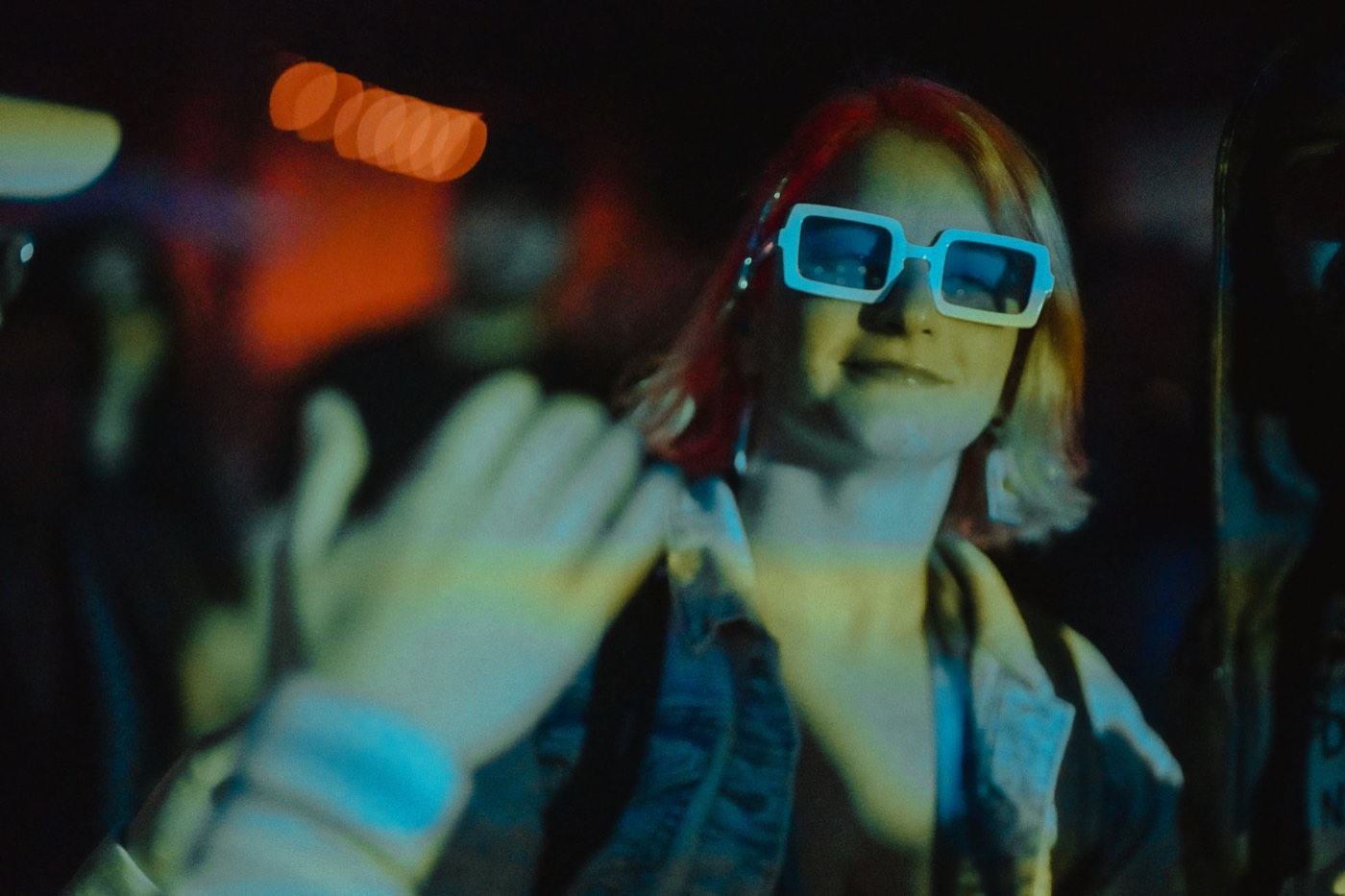 Festival goers in themed outfits at night